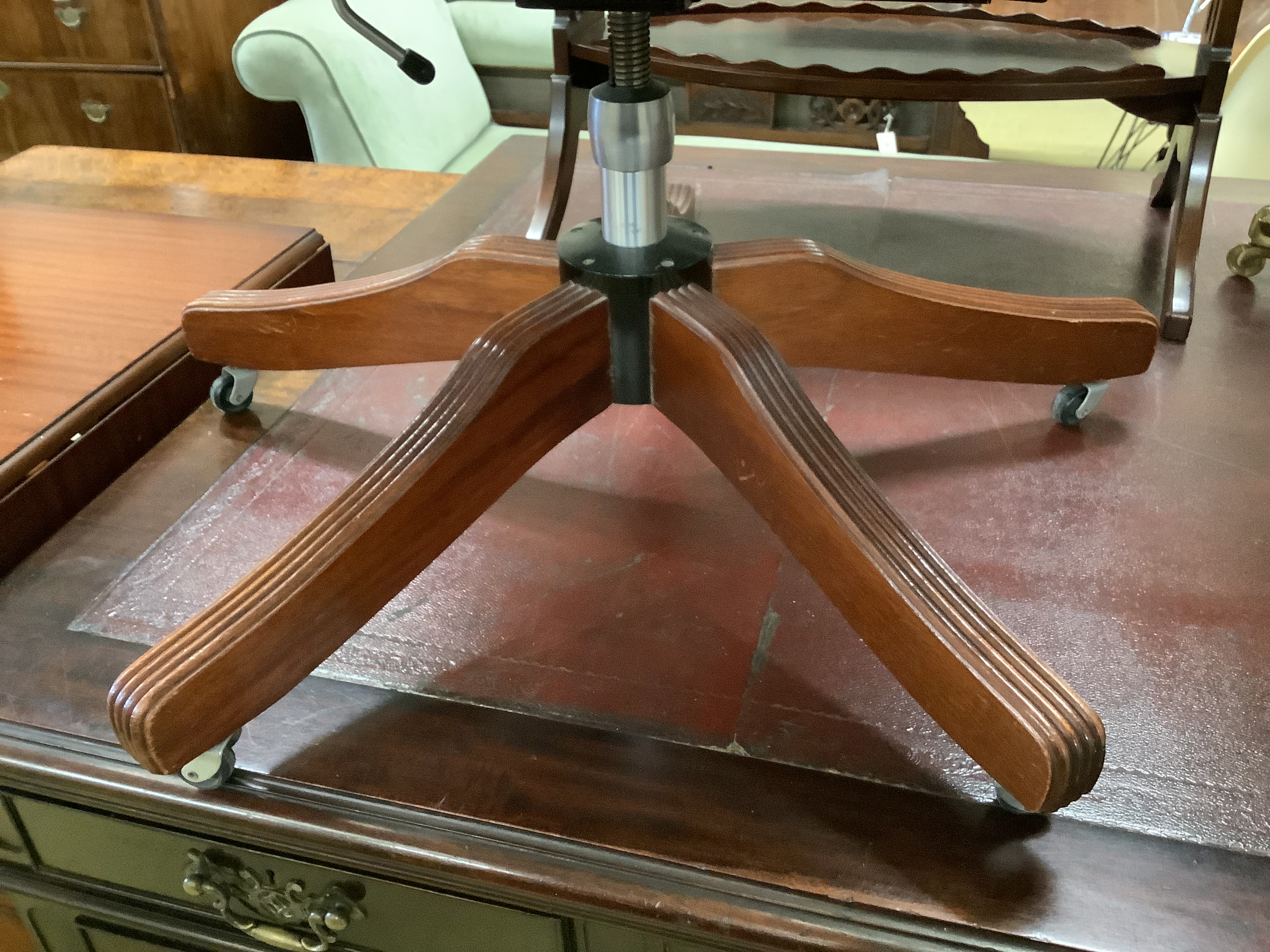 A mahogany and buttoned brown leather swivel desk armchair, width 60cm, height 84cm